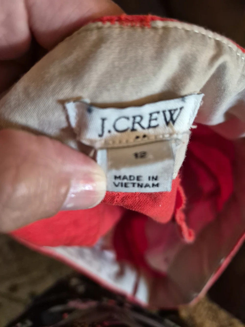 vibrant J.Crew coral 4-inch chino shorts featuring a classic mid-rise fit